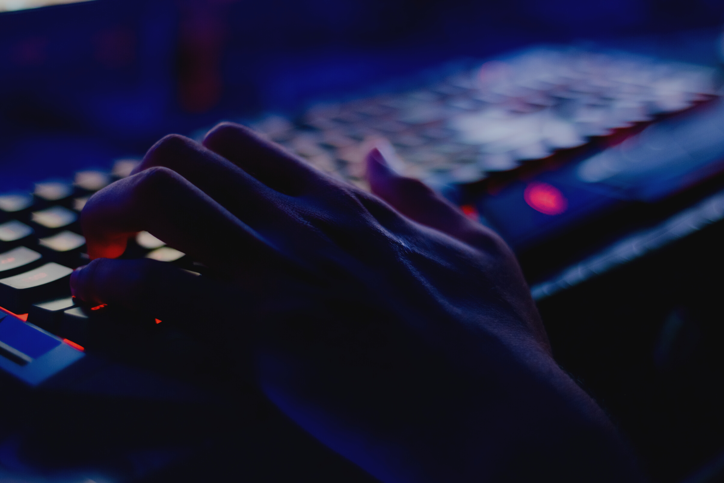 Photo of Person Typing on Computer Keyboard